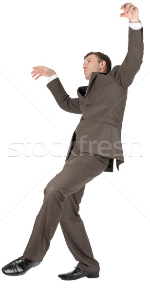 Businessman slipping on banana peel Stock photo © cherezoff