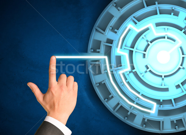 Businessmans hand touching holographic screen Stock photo © cherezoff