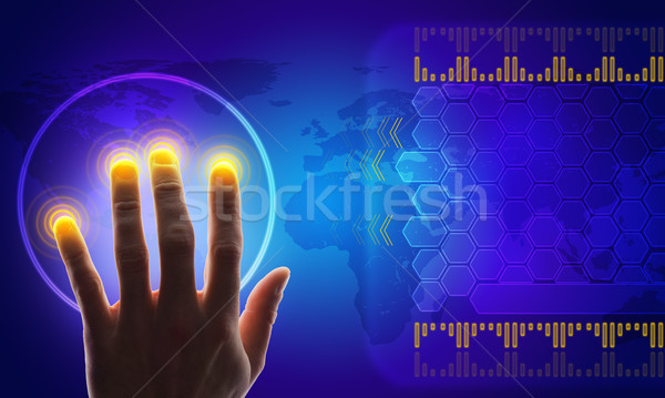 Buisnessmans hand touching holographic screen Stock photo © cherezoff