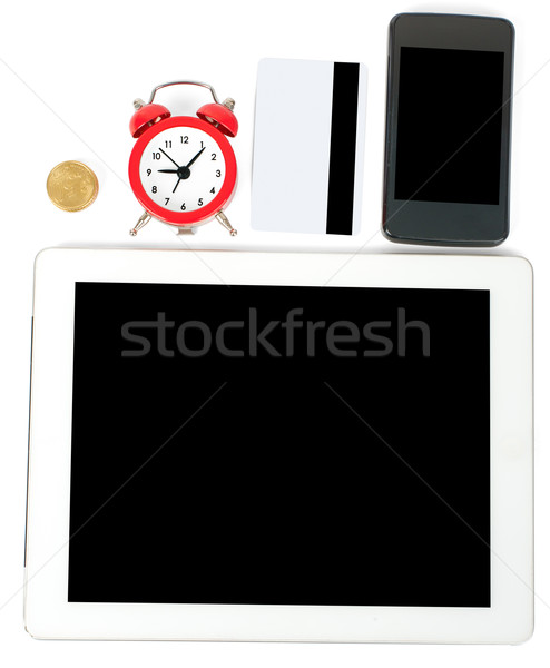 Tablet with smartphone and credits Stock photo © cherezoff