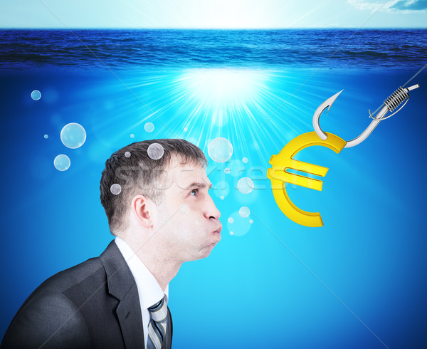 Stock photo: Businessman with inflated cheeks under water