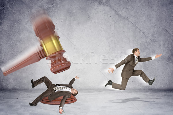 Inscribed gavel hitting businessman Stock photo © cherezoff