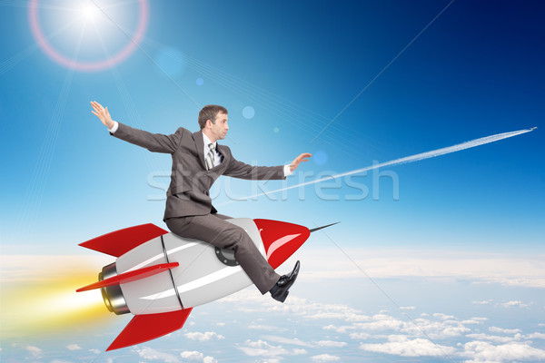 üzletember repülés rakéta rajzolt fölött felhőkép Stock fotó © cherezoff