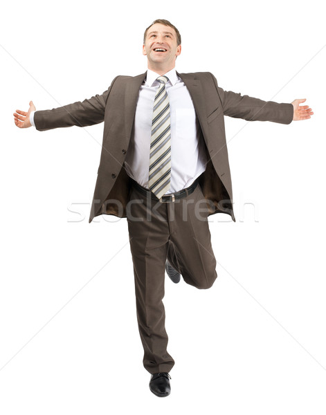 Happy businessman running forward Stock photo © cherezoff