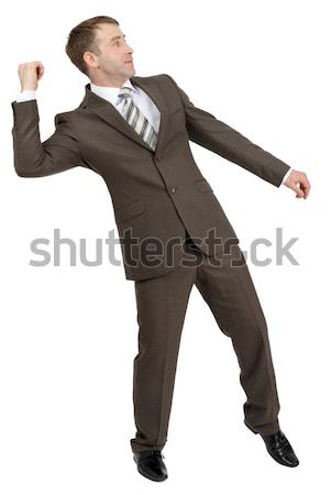 Businessman throwing invisible thing Stock photo © cherezoff
