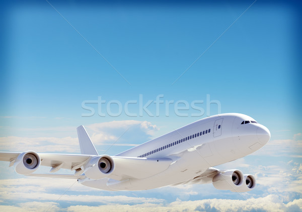 Jet vliegtuig boven wolken blauwe hemel reizen Stockfoto © cherezoff