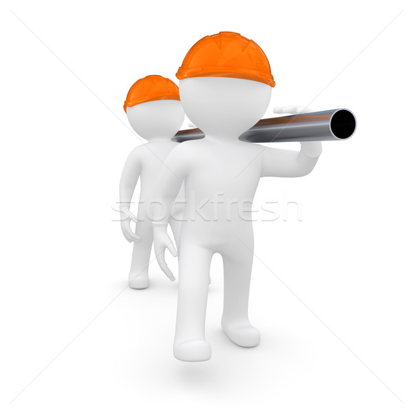 Two workers in helmets are a metal pipe Stock photo © cherezoff