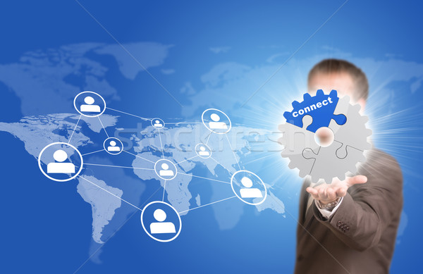 Business man hold gear. World map with contact icons Stock photo © cherezoff