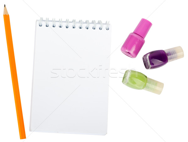 Open copybook with nail polishes Stock photo © cherezoff