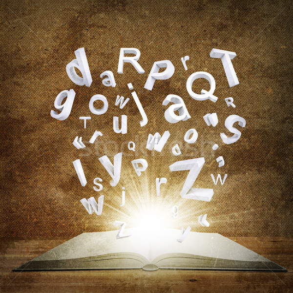 Letters are emitted from an open book Stock photo © cherezoff