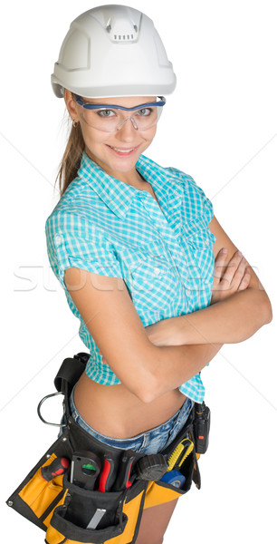 Woman in hard hat, tool belt and protective glasses Stock photo © cherezoff