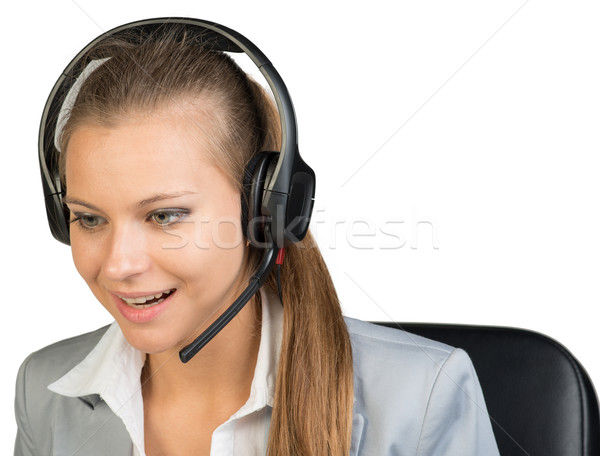 Businesswoman in headset Stock photo © cherezoff