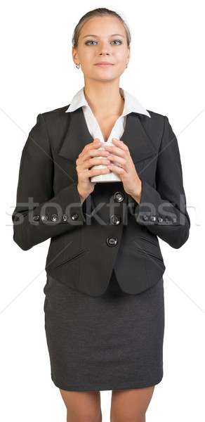 Businesswoman holding mug Stock photo © cherezoff