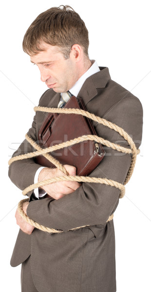 Young businessman tied with ropes Stock photo © cherezoff