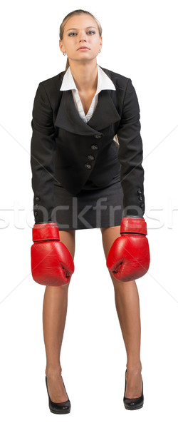 Businesswoman wearing boxing gloves Stock photo © cherezoff
