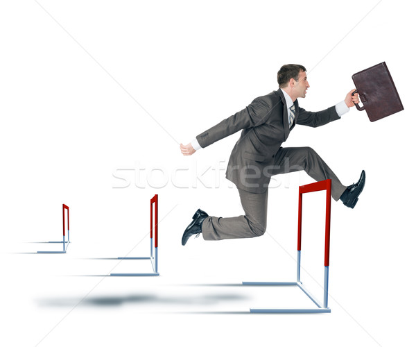 Businessman hoppig over barrier Stock photo © cherezoff