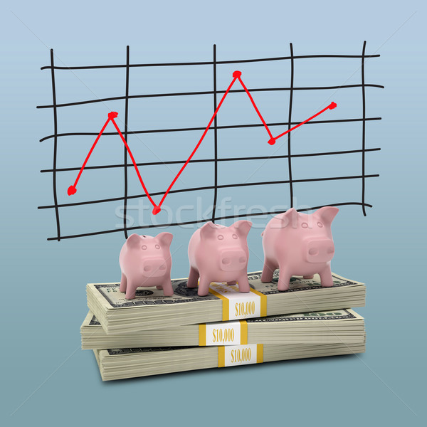 Piggy bank stand on pack of dollars Stock photo © cherezoff
