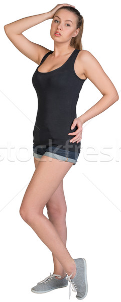 Woman in mini-shorts and a-shirt posing Stock photo © cherezoff