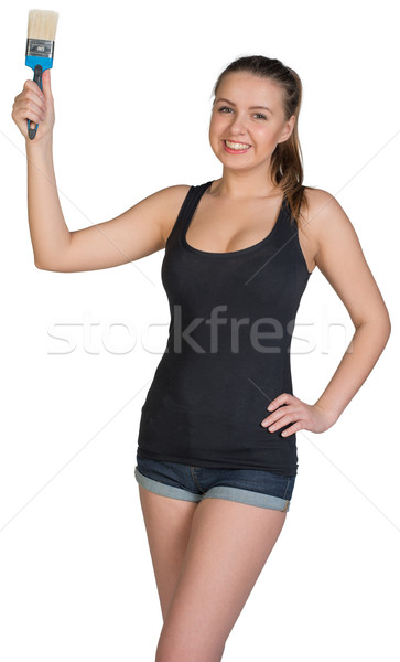 Woman holding paint-brush Stock photo © cherezoff