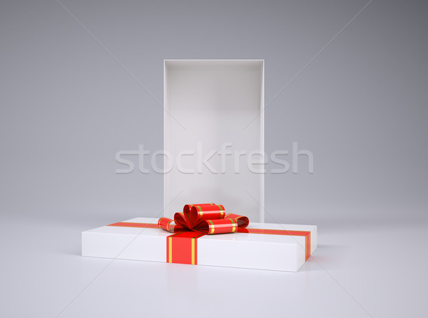 Open gift box and lid with ribbon Stock photo © cherezoff