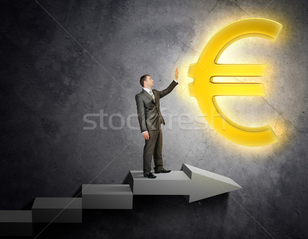 Businessman touching euro sign Stock photo © cherezoff