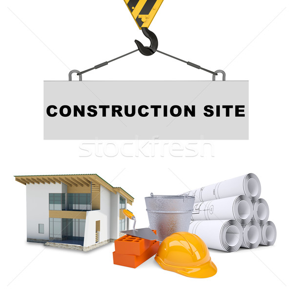 Building crane with house and bricks Stock photo © cherezoff