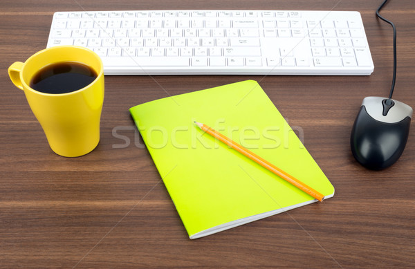 Keyboard with coffee and copybook Stock photo © cherezoff