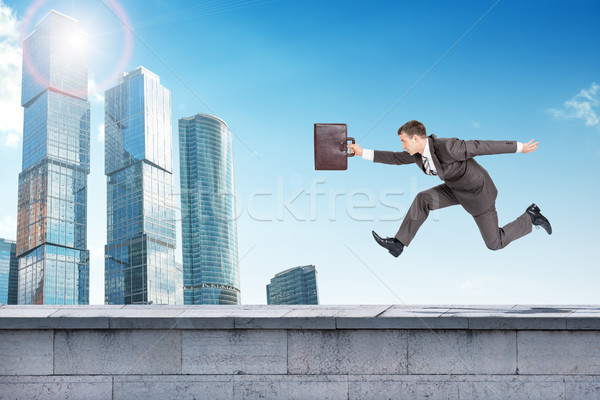 Businessman running forward Stock photo © cherezoff