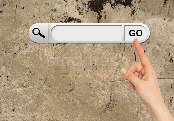 Human hand indicates the search bar in browser Stock photo © cherezoff