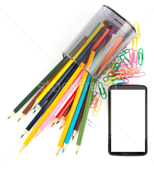 Pencil cup with crayons and smartphone, top view Stock photo © cherezoff