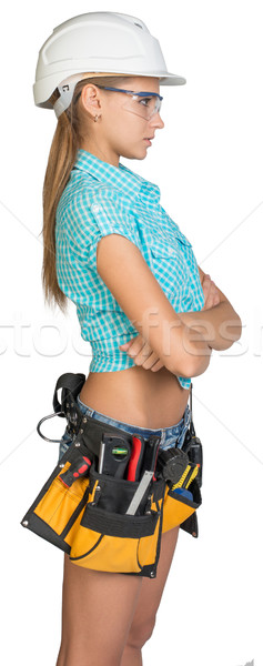 Woman in hard hat, tool belt and protective glasses Stock photo © cherezoff