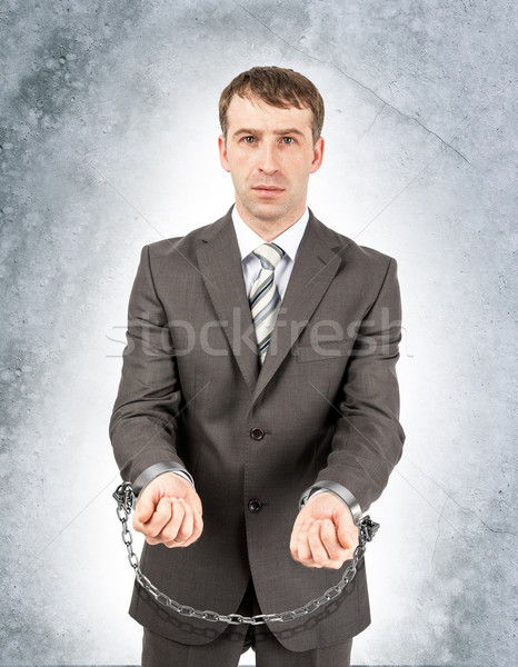 Enojado empresario gris pared mano hombre Foto stock © cherezoff