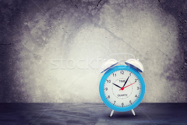 Concrete wall with fissure. Alarm clock in front at camera Stock photo © cherezoff