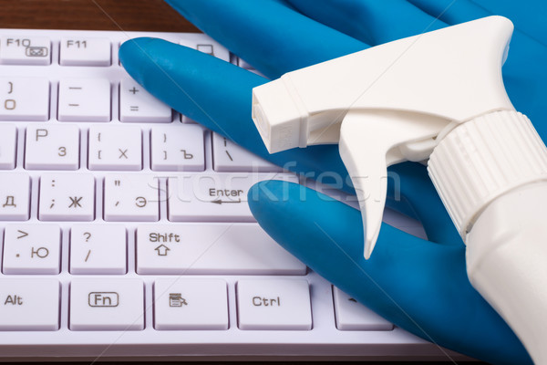Airbrush with rubber gloves on keyboard Stock photo © cherezoff