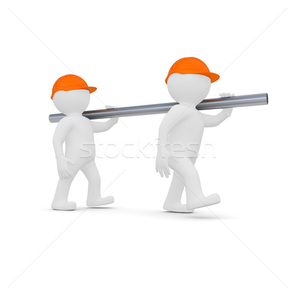 Two workers in helmets are a metal pipe Stock photo © cherezoff