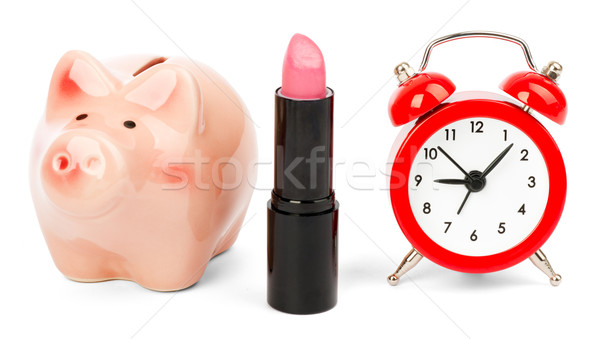 Lipstick with piggy bank on white Stock photo © cherezoff