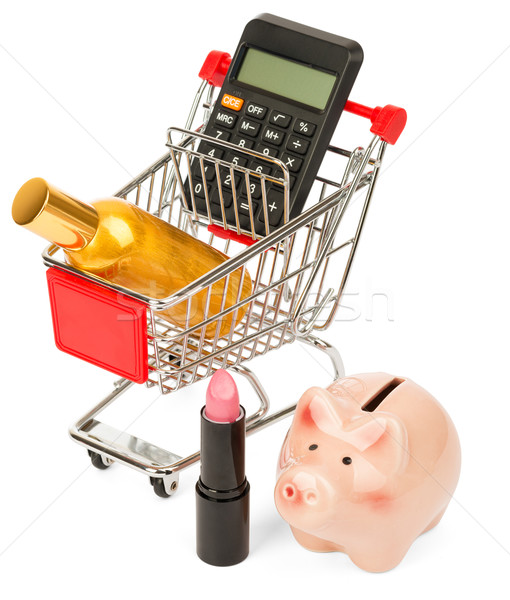 Calculator and perfume in shopping cart Stock photo © cherezoff