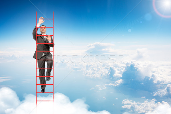 Stockfoto: Zakenman · klimmen · ladder · hemel · blauwe · hemel · kantoor