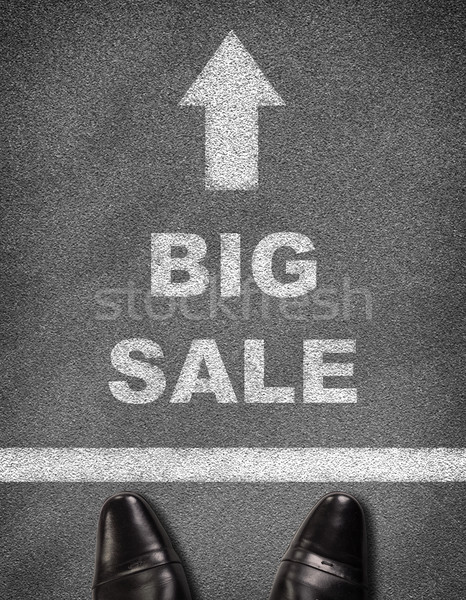 Shoes standing on asphalt road with arrow, line and text BIG SALE Stock photo © cherezoff