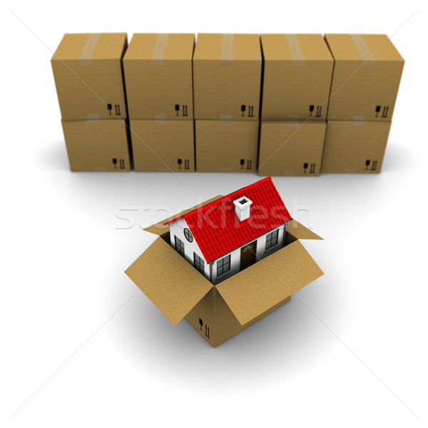 house from a cardboard box on the background of the group boxes Stock photo © cherezoff