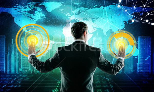 Businessman in suit push digital screen with icons Stock photo © cherezoff