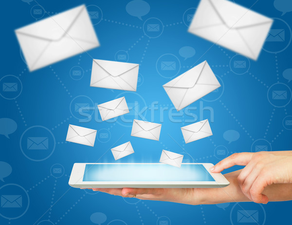 Hand, tablet pc and envelopes Stock photo © cherezoff