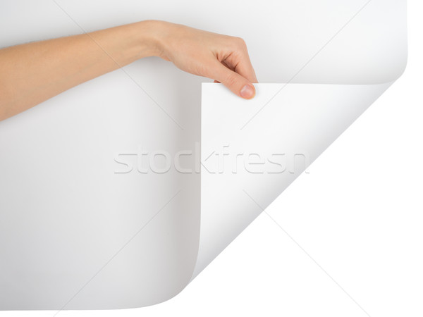 Womans hand turning empty page corner Stock photo © cherezoff