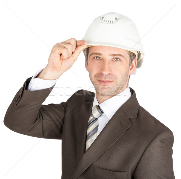 Businessman in suit raised his hard hat to greet Stock photo © cherezoff