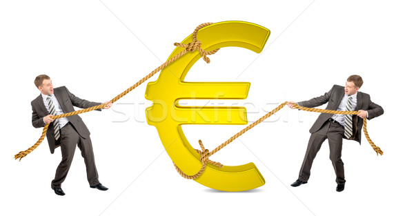 Businessman pulling euro sign against another man Stock photo © cherezoff