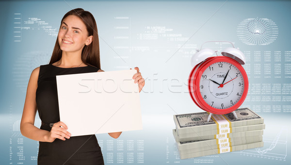 Stock photo: Businesswoman hold paper sheet. Alarm clock stand on dollar packs