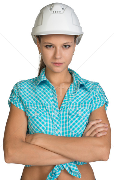 Pretty girl in shirt and white helmet standing with crossed arms Stock photo © cherezoff