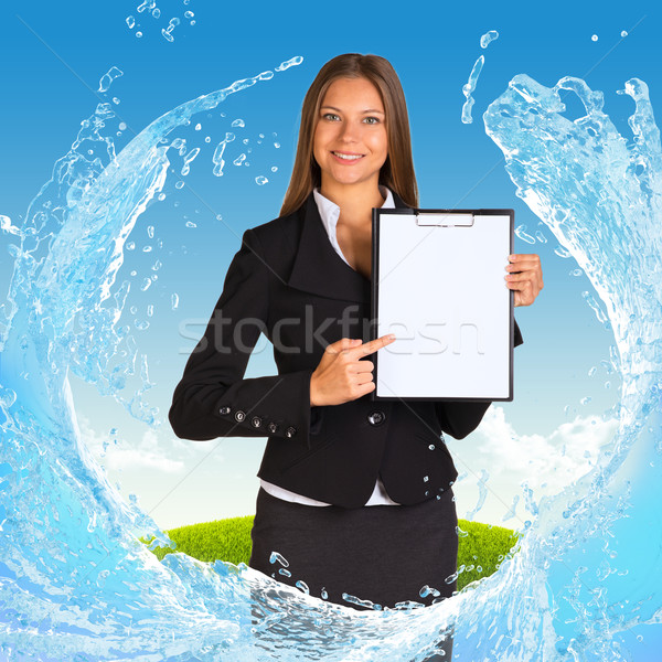 Businesswoman holding paper holder Stock photo © cherezoff
