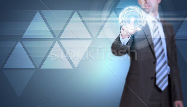 Stock photo: Businessman in suit finger presses virtual button