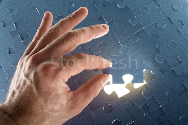 Missing jigsaw puzzle piece with light glow Stock photo © cherezoff